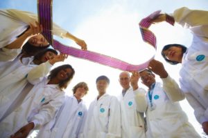 Group of CSIRO scientists holding ribbon together