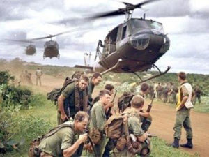 Vietnam soldiers with helicopter in background