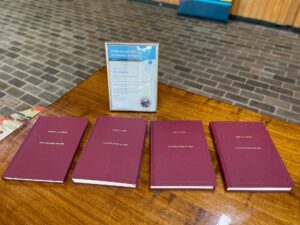 Research volume on a table at the entrance to the scholarship ceremony